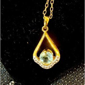 Natural Blue topaz and white zircon in 14k yellow gold plated necklace. 18”